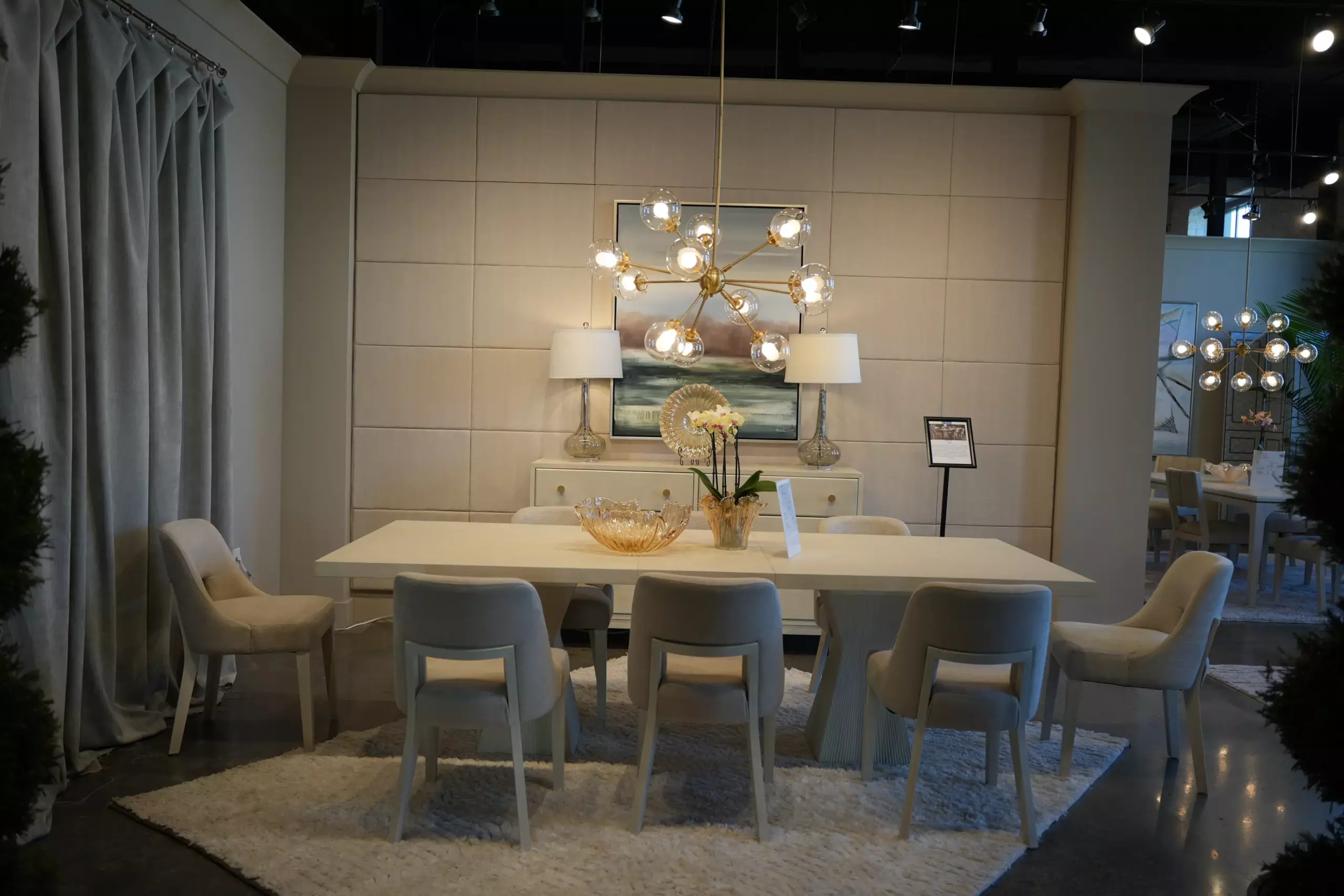 Modern dining set display with extendable table and upholstered chairs at Lifestyle showroom